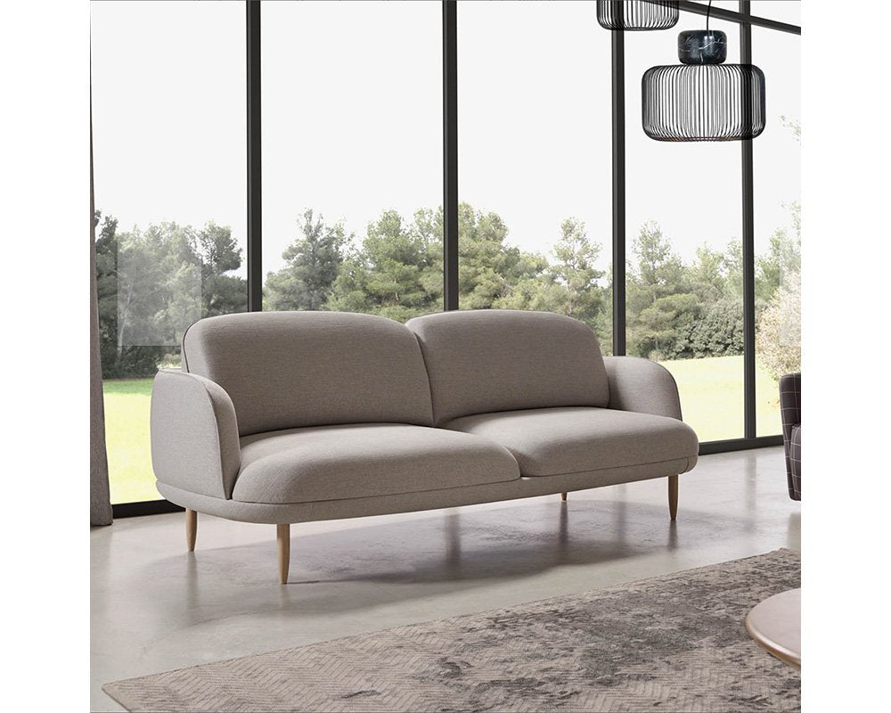 comfortable modern 3 seater sofa with soft edges and wooden legs available in marbella, malaga, estepona, costa del sol.