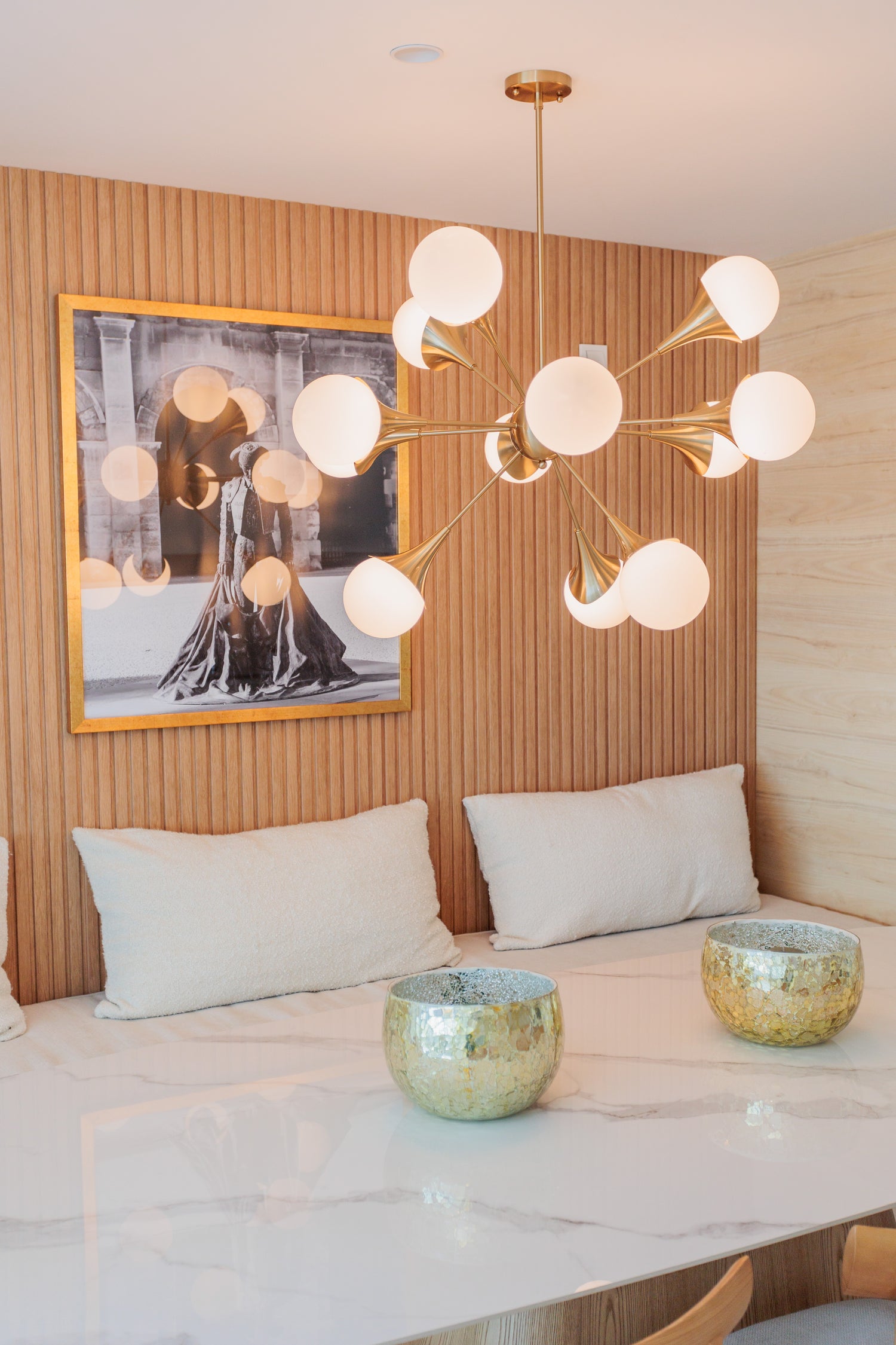 luxury home design with wooden panels, golden ceiling lamp, marble dining table, golden decors available in marbella, benalmadena, malaga, costa del sol.