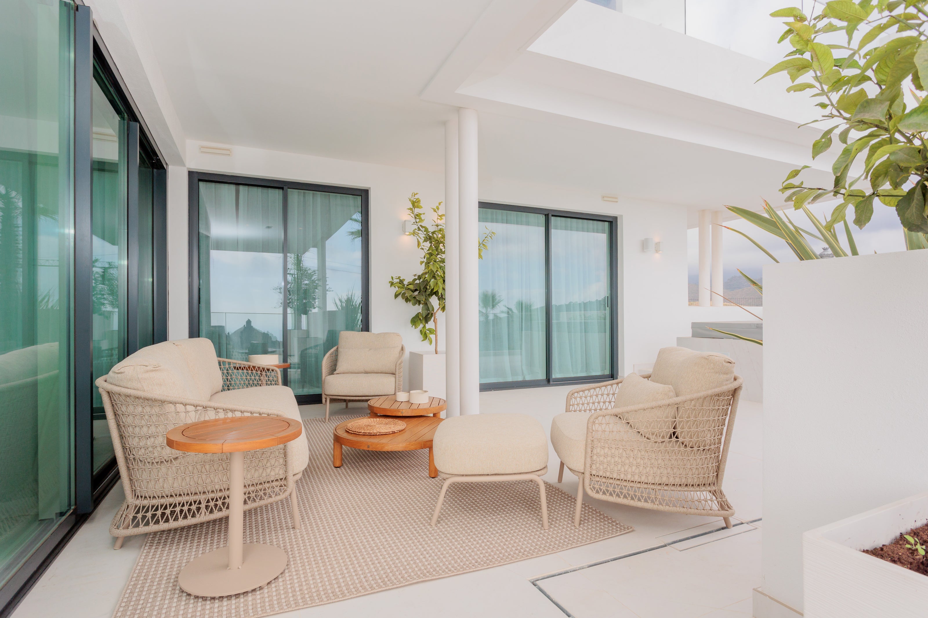 outdoor living interior design, elegant and modern outdoor sofa, outdoor armchair, pouf, rug, outdoor coffee tables and side tables available in marbella, malaga, costa del sol, bel air. 