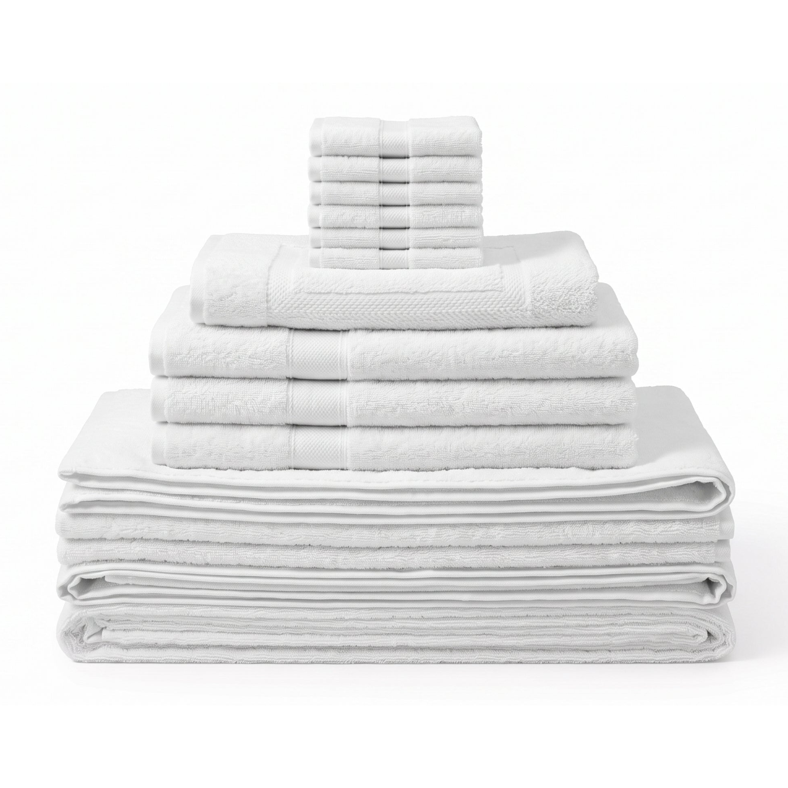 A stack of folded white towels in multiple sizes, including bath towels, hand towels, and washcloths, arranged neatly on a white background.