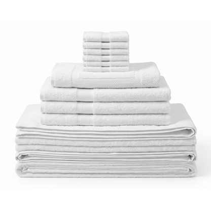 A stack of folded white towels in multiple sizes, including bath towels, hand towels, and washcloths, arranged neatly on a white background.
