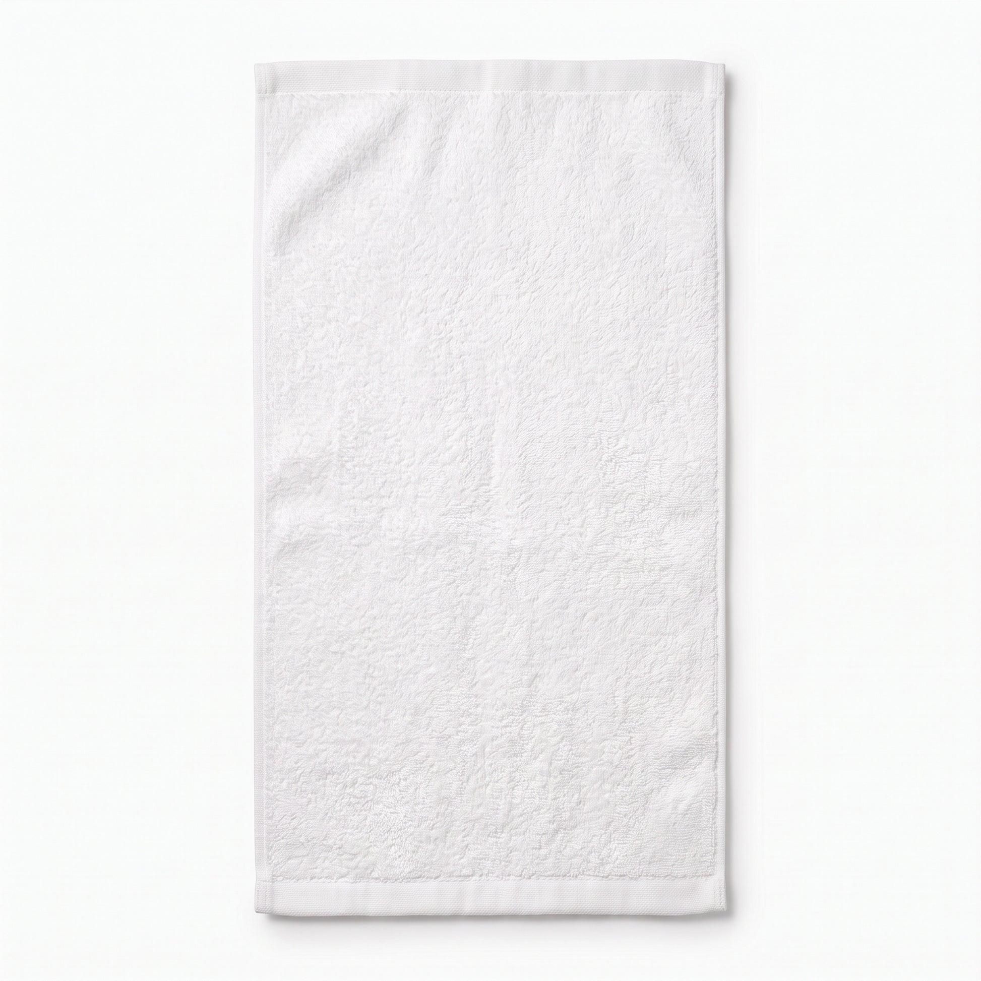 A white textured cotton towel with stitched borders, shown flat against a clean white background.