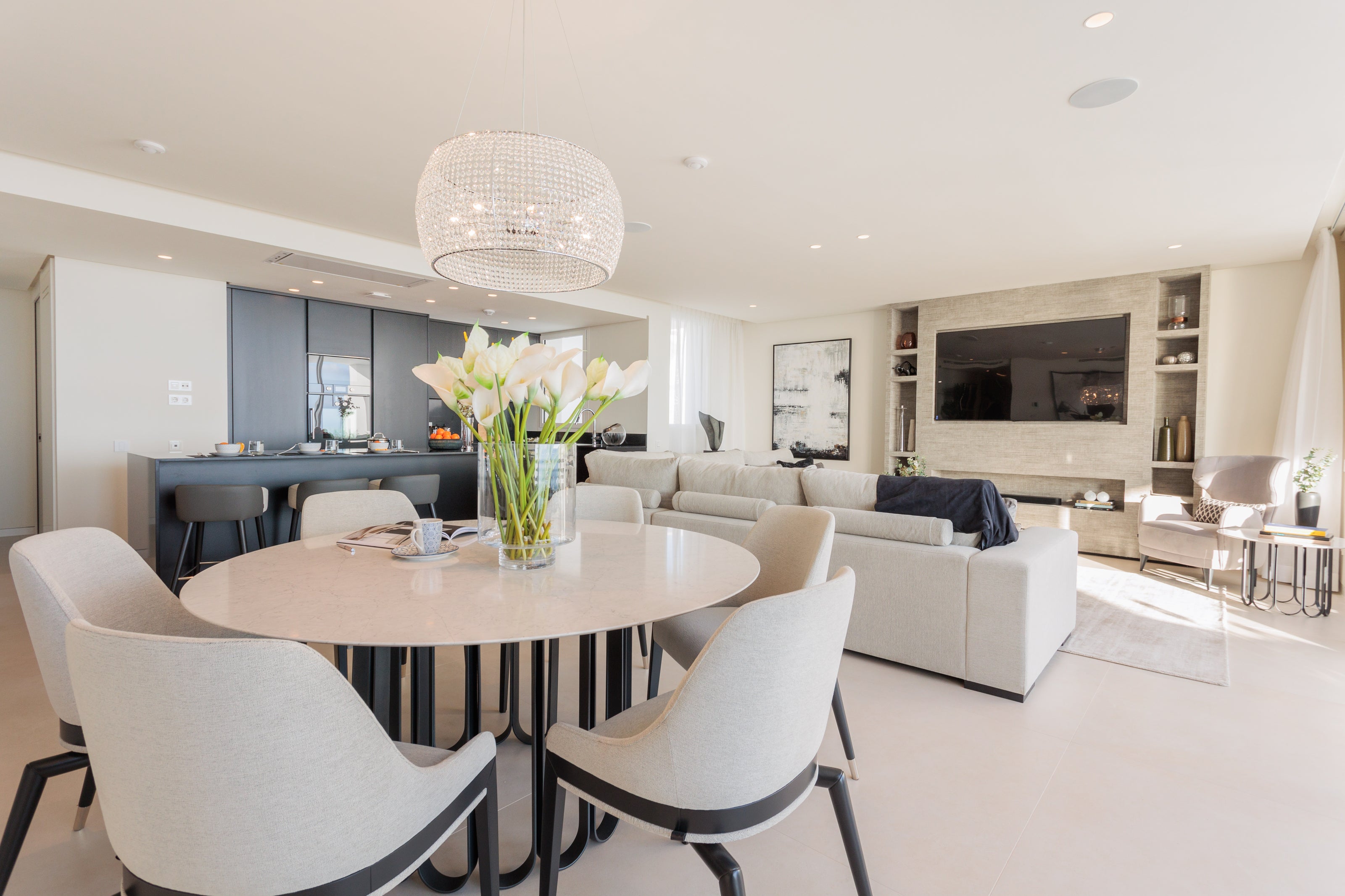 Contemporary modern interior design, home design with sofa, round dining table, dining chairs, ceiling lamp, and rug available in bel air, marbella, malaga, costa del sol.