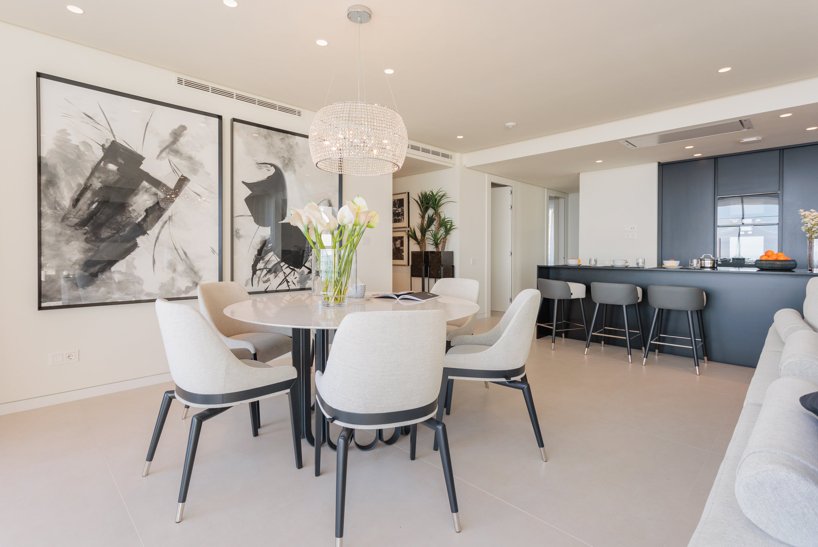 dining room interior design modern, with dining table and classic beige dining chairs, and chandelier available in malaga, marbella, THE ESTRELLA DEL MAR ELVIRIA INTERIOR DESIGN.