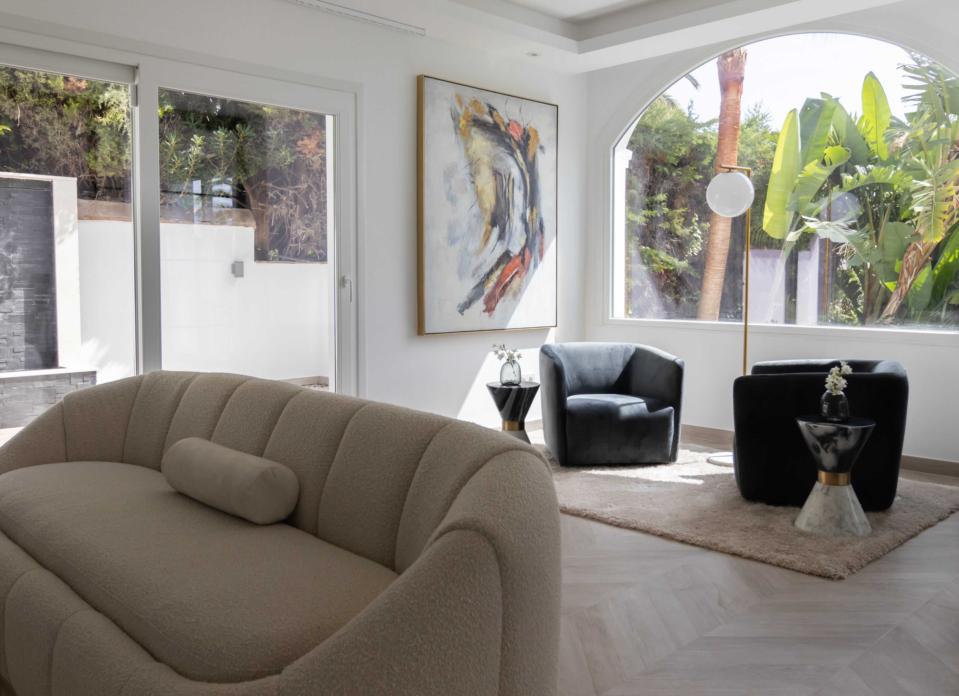 luxury interior design for home staging with elegant sofa, black armchairs, side tables and beige rug available in benalmadena, marbella, malaga, costa del sol.